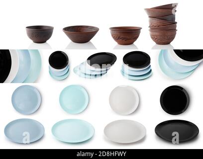 Set of empty plates and bowls of clay and ceramic isolated on white background. Stock Photo