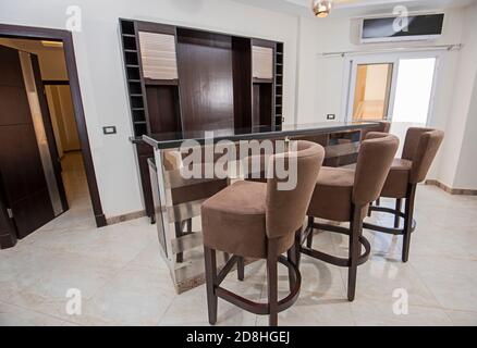 Interior design decor showing modern living room wet bar with cupboards in luxury apartment showroom Stock Photo