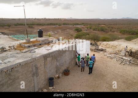 A team of cadastre technicians for the Land Management Project on Maio Island, Cabo Verde, map out coordinates for a property in Barreiro. July 15, 20 Stock Photo