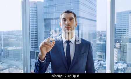 Point of View Shot of the Businessman Using Augmented Reality Touchscreen, Making Gestures. In the Background Big City Business District Panorama View Stock Photo