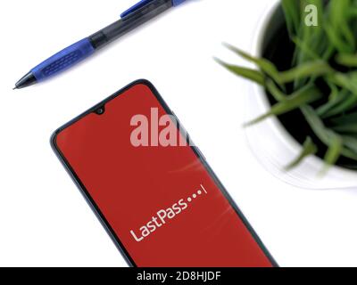 Lod, Israel - July 8, 2020: Modern minimalist office workspace with black mobile smartphone with LastPass Password Manager app launch screen with logo Stock Photo