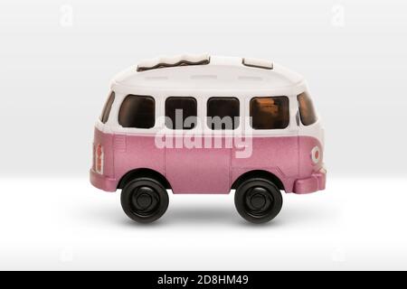 children's car minibus, pink with a white roof on a white background Stock Photo