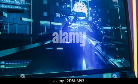 Close-up Shot of the Computer Screen with First-Person Shooter Online Video Game Gameplay in Progress. Stylish High-End Graphics Entertainment. Stock Photo
