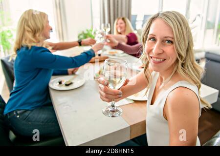 A Group of attractive mature people eating sushi at home Stock Photo