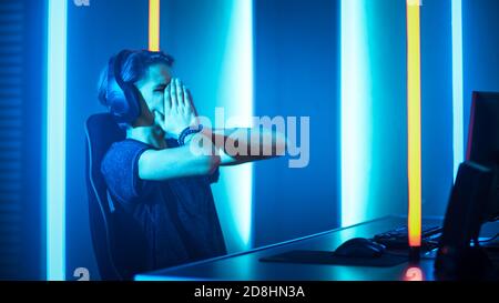 Young Pro Gamer Playing in Online Video Game Loses Big Tournament and is Disappointed. eSport Cyber Games Internet Event. Stock Photo