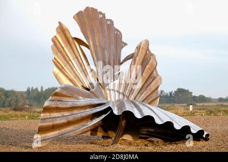 Sculpture of a Scallop Shell In Aldeburgh Suffolk in morning light.  By Maggi Hambling a Controversial Bronze Sculpture on the pebble beach. Stock Photo
