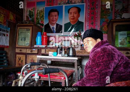 Portraits of Xi Jinping and Mao Zedong seen pasted at a home of an elderly woman in Anhui.Many people in China are very respectful to Xi Jinping and Mao Zedong. Especially in the countryside, people are willing to post pictures of Xi Jinping and Mao Zedong at home as a respect to the country's leaders. Stock Photo