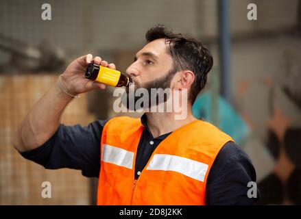 Manufacturing staff engineer in production of factory, professional, intelligence, blueprint, industry Stock Photo