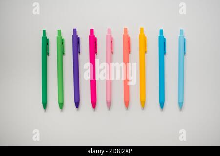 rainbow pens arranged on white background Stock Photo