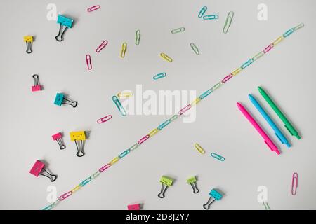 rainbow craft supplies on white table Stock Photo