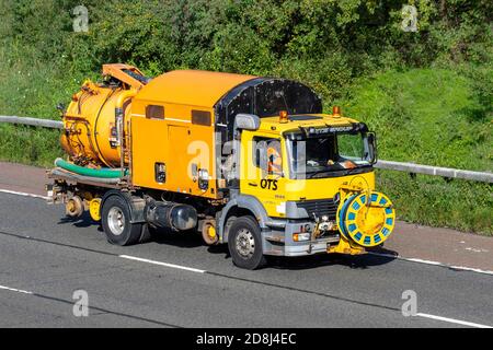 QTS Group Mercedes Benz 1828 Haulage delivery trucks, De-Mountable Road Rail JetVac Unit. lorry, heavy-duty vehicles,transportation, truck,  vehicle, European commercial transport industry HGV, M6 at Manchester, UK Stock Photo