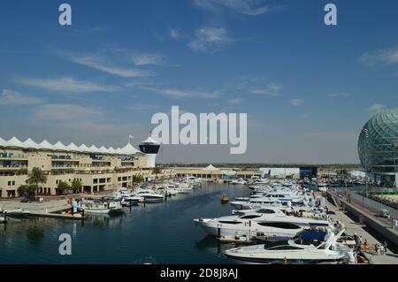 A distant perspective of the Yas Marina circuit, featuring the grandstands, team villas, and skyline. Stock Photo