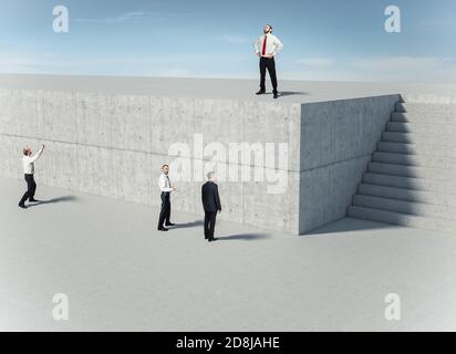 business people in front of a concrete wall, one of them finds the solution and uses the stairs. Concept of resourcefulness and problem solving. Stock Photo