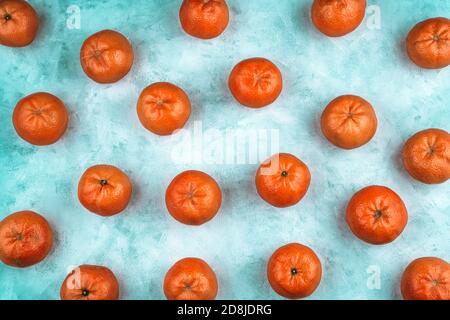 Abstract fruit background with tangerines on a blue background. Stock Photo