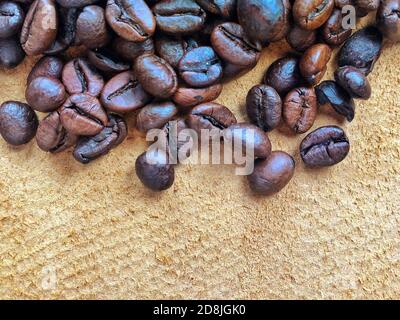 brown coffee, background texture, close-up. coffee beans on a suede background, concept. Texture of coffee beans on brown background Stock Photo