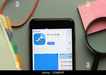 New York, USA - 26 October 2020: Switch Tables mobile app logo on phone screen close up, Illustrative Editorial Stock Photo