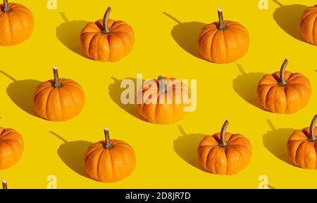 Pumpkin seamless pattern on orange background Stock Photo