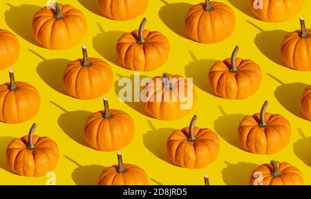 Pumpkin seamless pattern on orange background Stock Photo