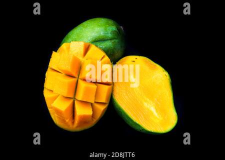 mango slices isolated on black background, perfect for smartphone, tablet and desktop wallpapers Stock Photo