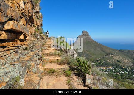 Hiking trail at Table Mountain and view of Lion's head mountain in the distance, Table Mountain national park, Cape Town , South Africa Stock Photo