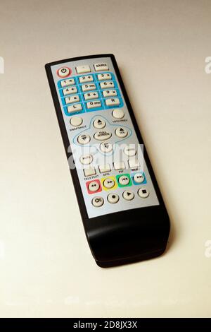 TV remote isolated on white background. Remote control for TV, DVD player, CD player, car radio or another player. Stock Photo