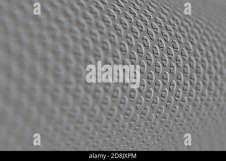 embossed detail of a tractor oil filter creates an industrial textured background Stock Photo