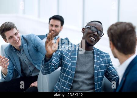 close up.cheerful co-workers giving each other a high five Stock Photo