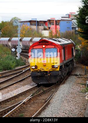 DB Schenker Class 66 Locomotive 66206 passes Peterborough on the East Coast Main Line hauling an train of HJA aggregate hopper wagons Stock Photo