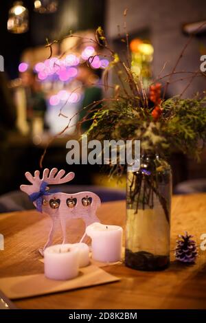 Minimalistic Christmas decor cozy warm room with wooden furniture. Stock Photo