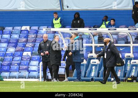 Mark Robins Manager of Coventry City and Tony Mowbray manager of Blackburn Rovers bump fists at the end of the game Stock Photo