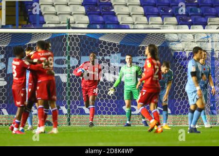 Birmingham, UK. 30th Oct, 2020. Alf Semedo of Reading (on loan from Benfica) retrieves the ball from the net, as his team mates celebrate their second goal - with little time remaining in the game - in the Sky Bet Championship match between Coventry City and Reading at St Andrews, Birmingham, England on 30 October 2020. Photo by Nick Browning/PRiME Media Images. Credit: PRiME Media Images/Alamy Live News Stock Photo