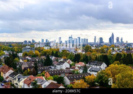 Beautiful aerial view on european finance center city Frankfurt am Main downtown skyline in autumn.  cloudy sky, clouds, colorful trees. Hesse, German Stock Photo