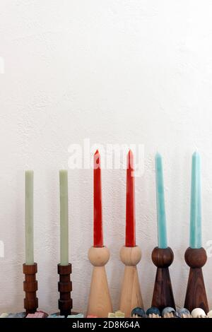 Modern wooden candlestick holders on display. Stock Photo