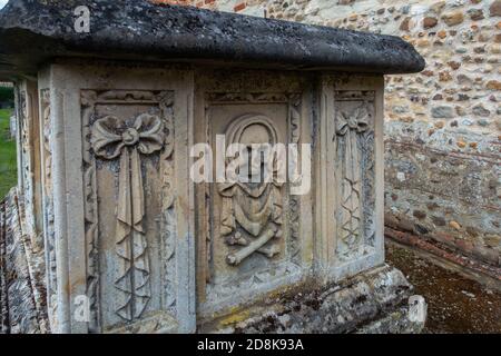 The parish church of St Guthlac in Astwick, Bedfordshire dates from the 15th century. An unusual feature is a chimney protruding from the roof. Stock Photo