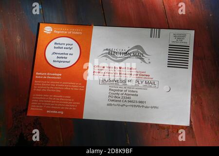 Alameda County Election absentee or mail-in ballot in envelope for the 2020 Presidential Election. Bilingual ballot to Registrar of Voters. USA Stock Photo