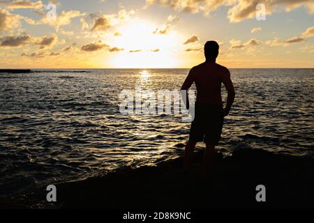 The Hawaiian sunset with Silhouette in front view Stock Photo