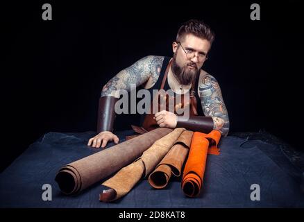 Professional Tanner produces a good product in his workplace Stock Photo