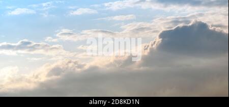 Cloudy sky at sunset or sunrise. Sky in the lilac and blue colors. Light pastel colored sunset clouds. Magnificent cloudscape Stock Photo
