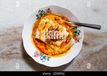 Serving of curry chee cheong fun, popular breakfast in Malaysia among Chinese. Stock Photo