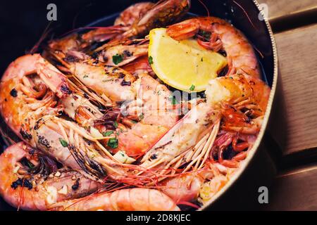 Fresh Adriatic shrimp served in buzara sauce (shallow dof) Stock Photo
