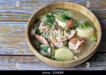 Tube tofu with shrimp and vegetables are the foods that Thai people tend to eat often put in wooden cups. Stock Photo