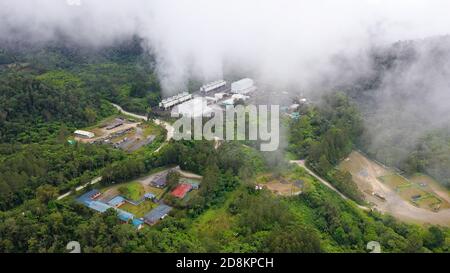 Geotermal power plant on Mount Apo. Geothermal station with steam and pipes in the rainforest. Mindanao, Philippines. Stock Photo