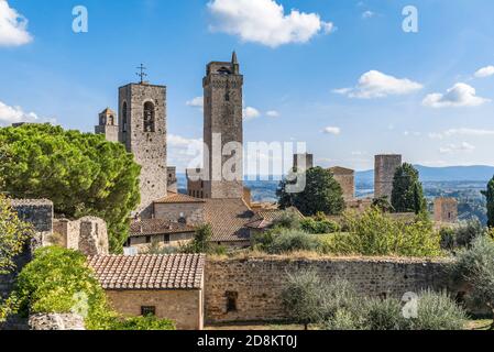 The famous medieval towers over the roofs of the Tuscan city of San Gimignano, Italy Stock Photo