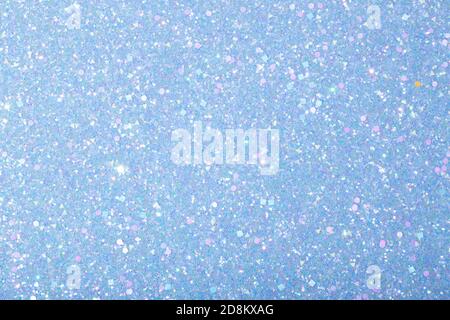 Holographic bright light blue glitter real texture background Stock Photo -  Alamy