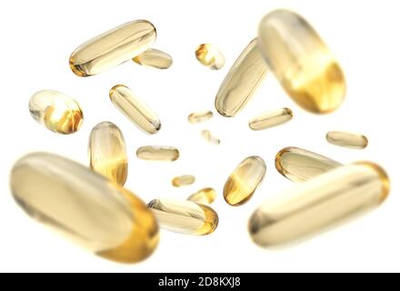 Yellow capsules levitate on a white background Stock Photo