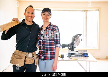 A couple worker in the carpenter workroom renovation Stock Photo
