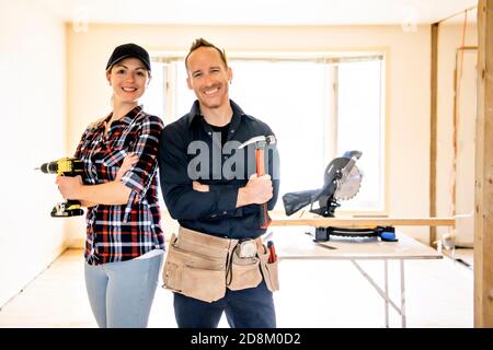 A couple worker in the carpenter workroom renovation Stock Photo