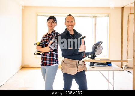 A couple worker in the carpenter workroom renovation Stock Photo