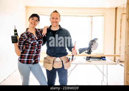 A couple worker in the carpenter workroom renovation Stock Photo