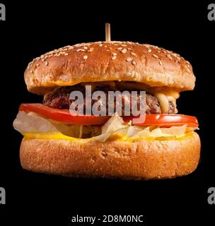 Burger isolated on black background. Stock Photo